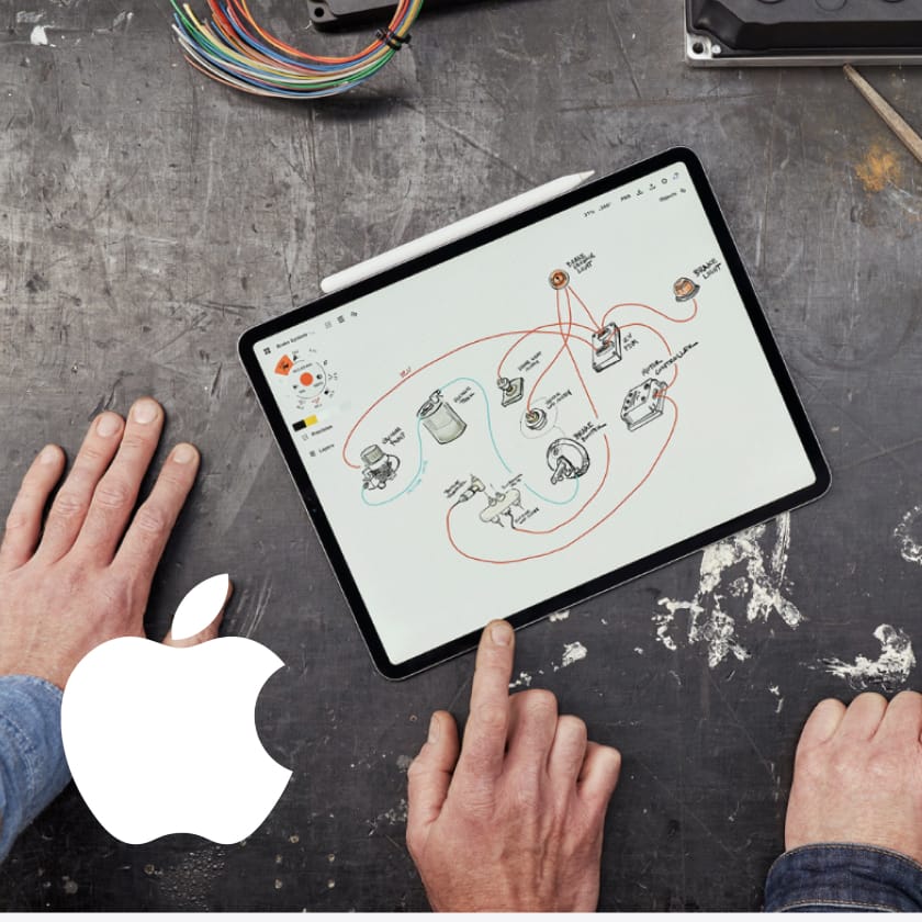 An iPad on the workshop bench showing the Jaunt electric Mini drivetrain laid out as a schematic.