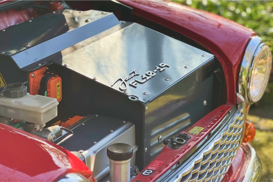 Classic Mini engine bay with the Jaunt electric drivetrain and battery module installed where the petrol four used to sit.