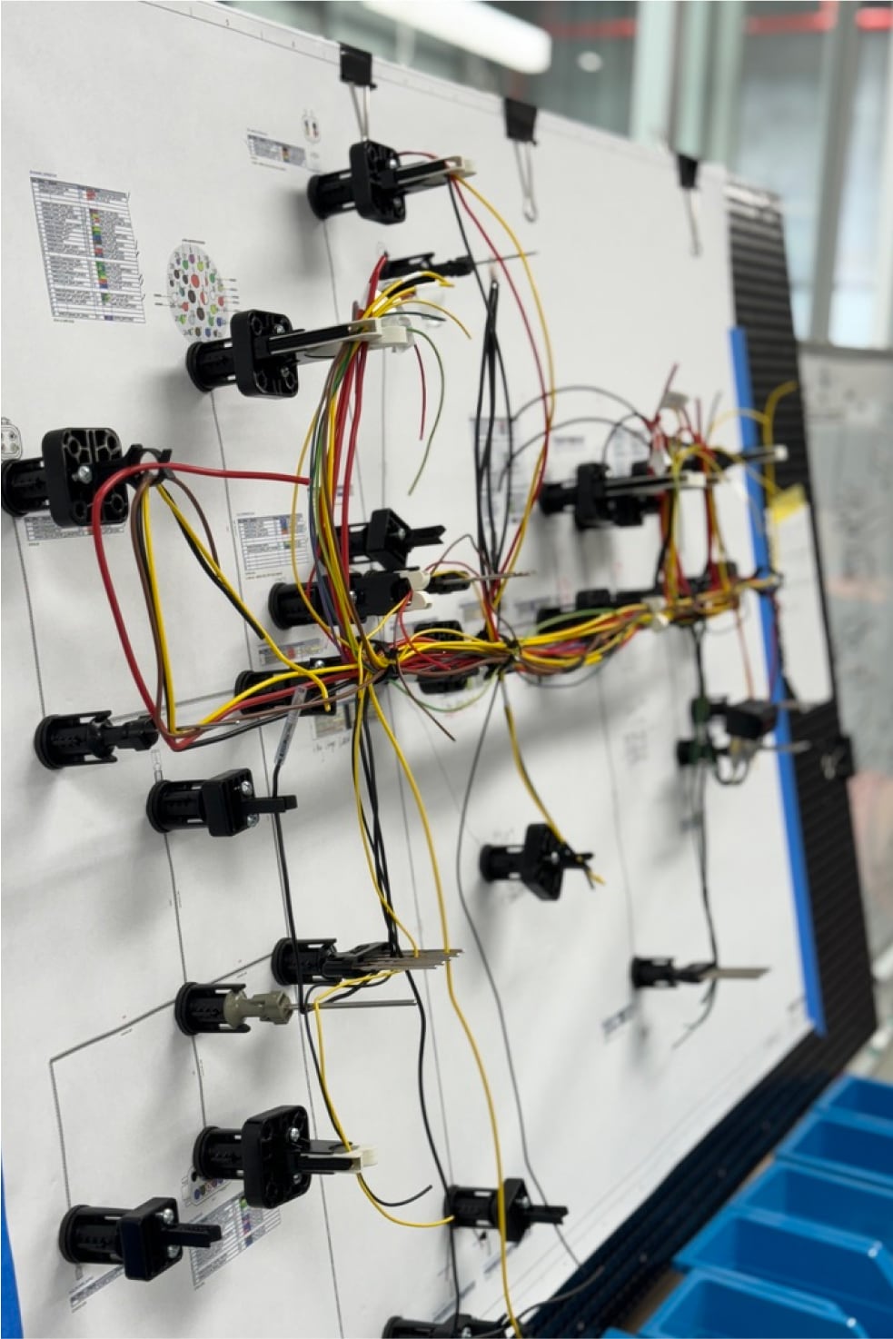 Wiring harness assembled on a CAD-printed looming board in the electrical build room