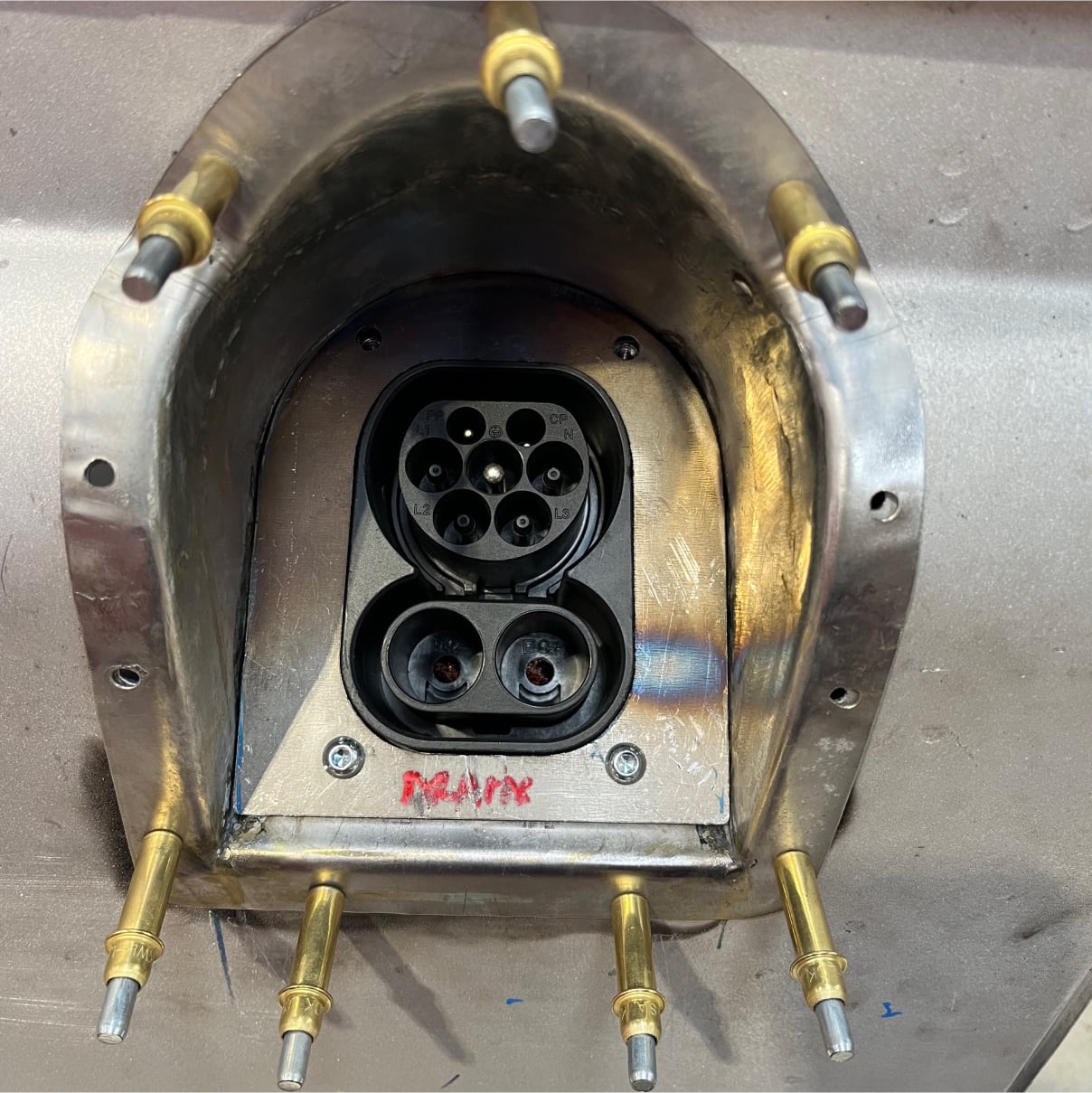 CCS2 charge port integrated into rear panel